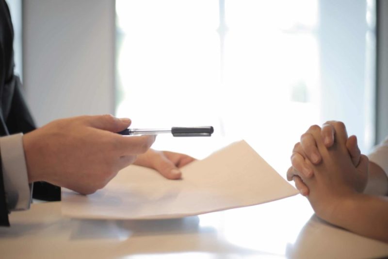 two people reviewing a contract
